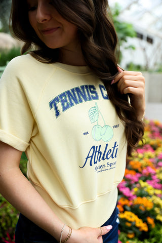 women's yellow tennis sweater 