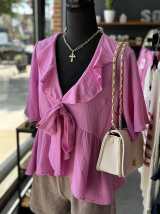 pink blouse that ties