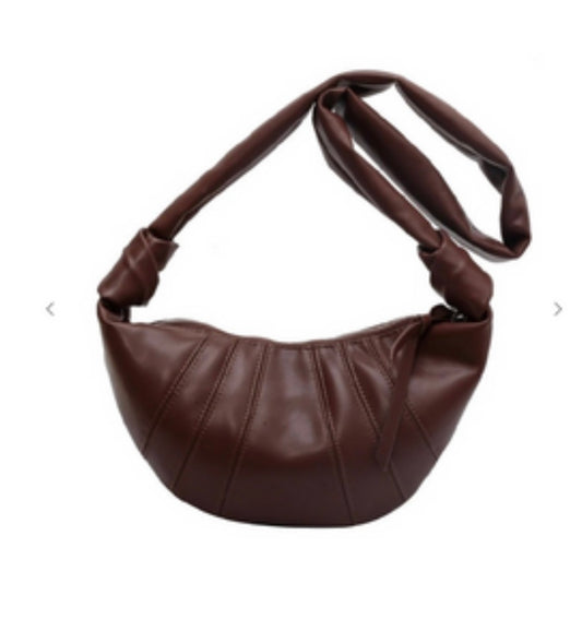 Brown leather handbag on a white background